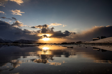 The sun is breaking through the clouds