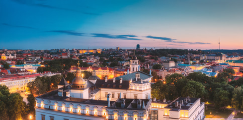 Fototapeta premium Vilnius, Lithuania, Eastern Europe. Night Panoramic View Of Historic Center Cityscape In Blue Hour. Travel View Of Old Town In Night Illuminations. UNESCO. Palace Of The Grand Dukes Of Lithuania.