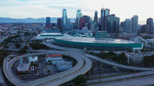 Urban aerial view of downtown Los Angeles skyscraper buildings and city skyline with empty freeway during COVID-19 or covid pandemic