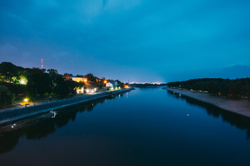 Fototapeta na wymiar Gomel, Belarus. Night View Of Sozh River, Sand Beach, Lighted Embankment In Gomel, Homiel, Belarus. Summer Evening Night Blue Sky