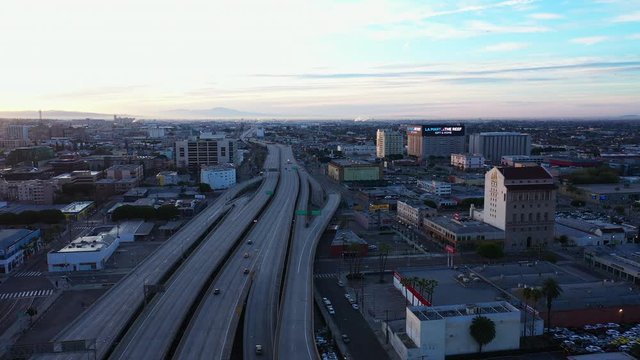 Aerial view of empty freeway with few cars in Los Angeles California as result of  coronavirus pandemic or COVID-19 virus outbreak and lockdown