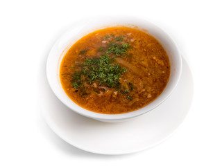 Ukrainian traditional borsch in a plate isolated on white background. Food.