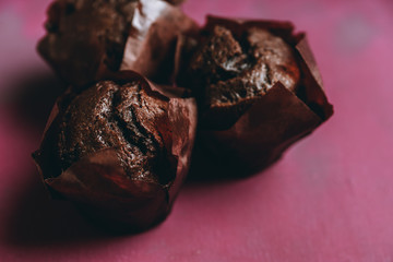 Homemade chocolate muffin on the rustic background. Selective focus. 