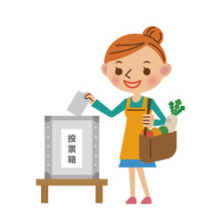 投票するエプロン姿の主婦