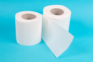 white toilet paper roll on blue background