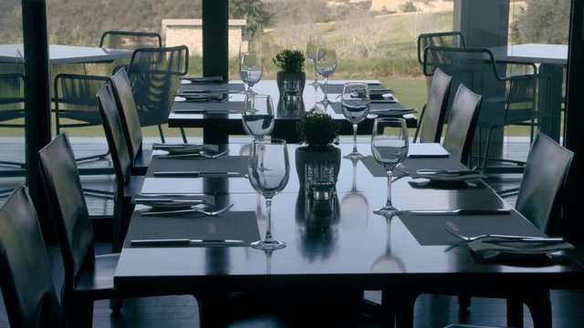 The waiter serves the table for launch 
