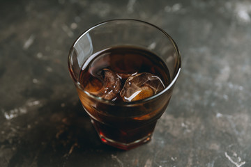 Black russian cocktail with ice and coffee liquor. Selective focus. Shallow depth of field.