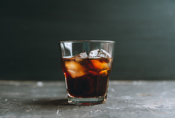 Black russian cocktail with ice and coffee liquor. Selective focus. Shallow depth of field.