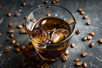 Black russian cocktail with ice and coffee liquor. Selective focus. Shallow depth of field.