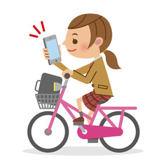 Fototapeta premium スマートフォンを見ながら自転車を運転する女子生徒