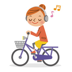 ヘッドフォンで音楽を聴きながら自転車を運転する女性