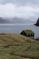 Abandoned cabin on a coast of Faroe islands. Isolated place  made for introvert people or people in...