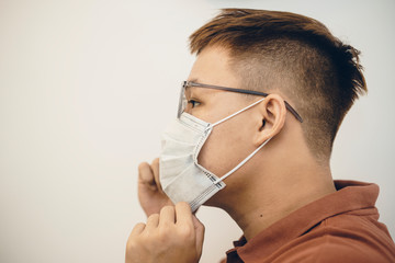 Protection against coronavirus in workplace. Asian man wearing medical mask