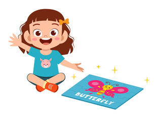 Fototapeta premium happy cute little kid girl play jigsaw puzzle