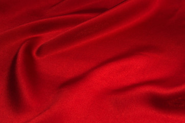 Fototapeta na wymiar red satin or silk fabric as background