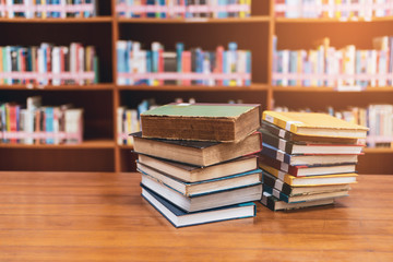 Stack of books in the library.Education concept Library with many shelves and books