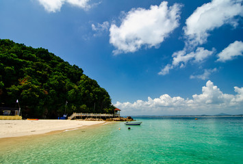 beauty in nature, Kapas Island located in Terengganu, Malaysia under bright sunny day and cloudy sky