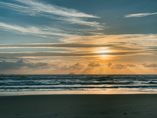 Beautiful sunrise, sunset of the sun through the clouds