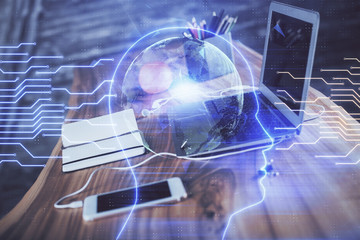 Double exposure of table with computer and brain hologram. Data innovation concept.