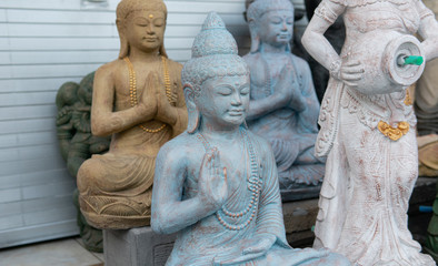 Fototapeta na wymiar .statues of indonesian gods, hindu deities. Travel souvenirs in the form of statues of deities