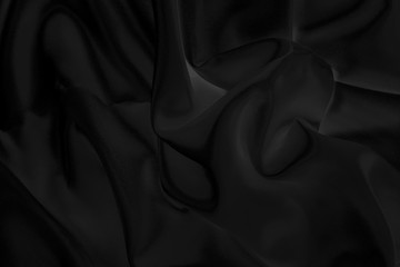 Black fabric texture for background; Abstract black fabric cloth wave or wavy folds texture material for background