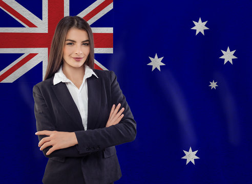 Distance Learning In Australia. Young Woman Student And Australian Flag