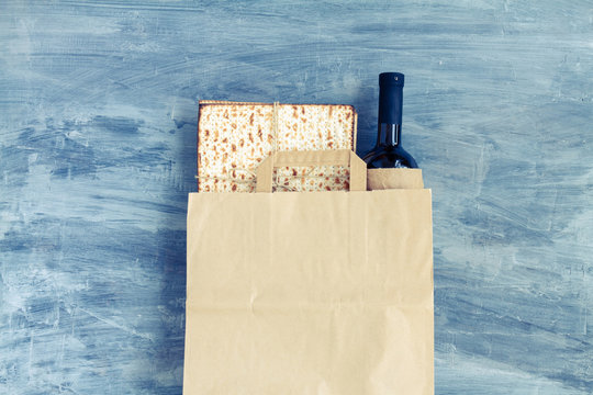 Passover Grocery Shopping Composition With A Matzah Or Matza And Red Kosher In A Paper Shopping Bag. Top View Or Overhead View Composition With Copy Space