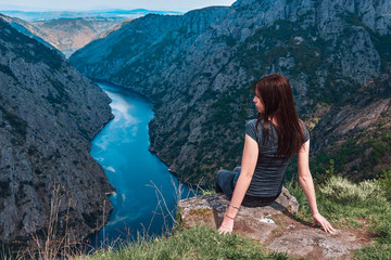 Young woman contemplating the Sil Canyons in Ourense, Spain