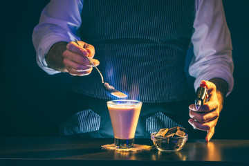 Bartender making a burning cocktail