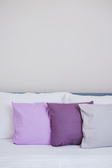 Fototapeta na wymiar Interior design with pillows on sofa, closeup.