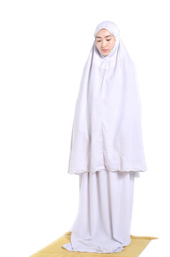 concept for eid mubarak and soul fasting of islamic ramadan, young female muslim with hijab praying