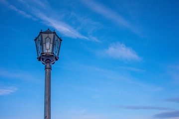 Fototapeta na wymiar street lamp on sky background