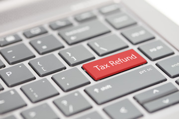 Tax filing, GST, SST, VAT, tax return and tax refund word on keyboard for Taxation related...