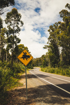 sign warning of tasmanian devil near road in tasmania australia