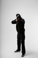 Man in mask With gun on white background