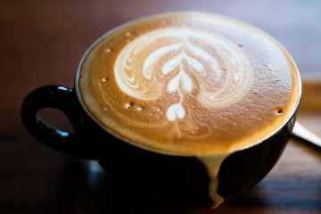 Hot coffee latte art in cup. hot drink coffee with milk froth for breakfast.