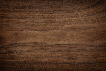 Walnut wooden chopping board texture background. Old wooden chopping board with knife pattern.