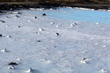 clear water sky blue colors on a lava field. The blue Lagoon in Iceland