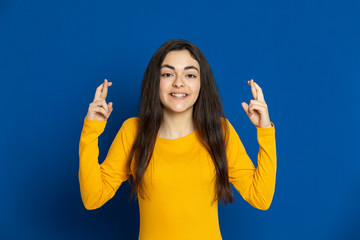 Brunette young girl wearing yellow jersey