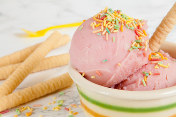 Two strawberry ice cream balls  close-up
