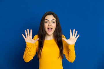 Brunette young girl wearing yellow jersey