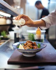 Cooking japanese katsudon rice with fried chicken, japanese food, restaurant kitchen 