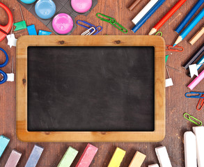 Chalk blackboard with school supplies