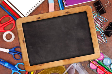Chalk blackboard with school supplies