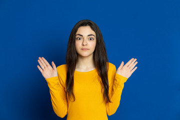 Brunette young girl wearing yellow jersey