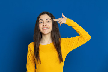 Fototapeta premium Brunette young girl wearing yellow jersey