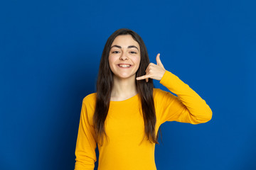 Fototapeta premium Brunette young girl wearing yellow jersey