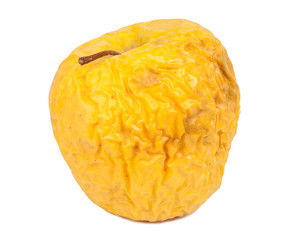 Shriveled apple on white background