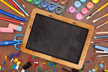 Chalk blackboard with school supplies