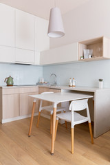 Sweet interior. Scandinavian-style kitchen in daylight. Vertical stories.